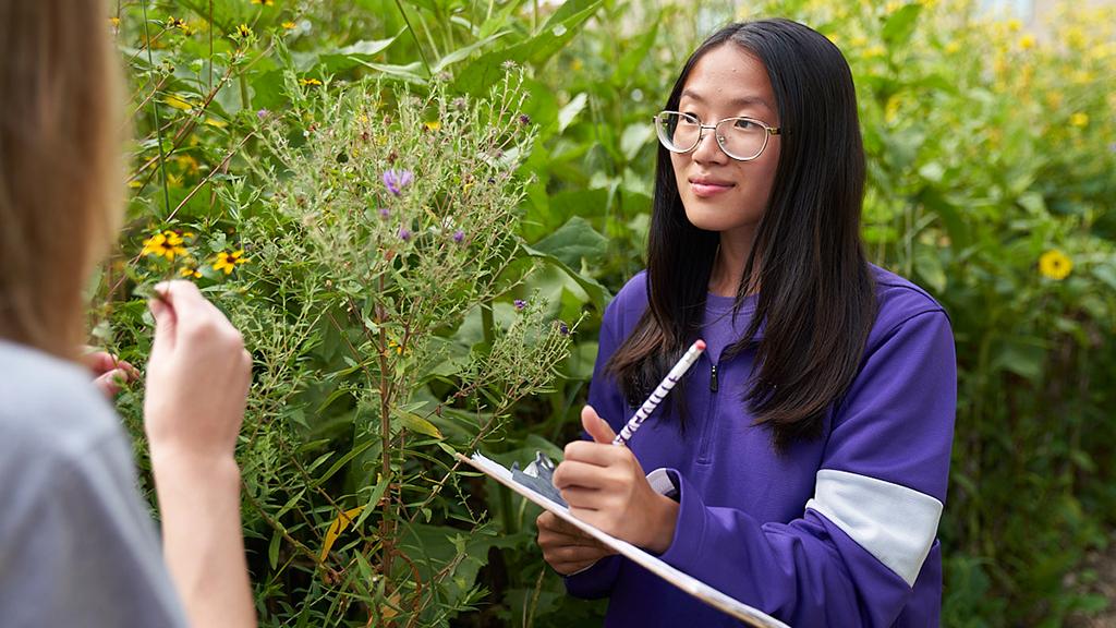 Biology student with clipboard